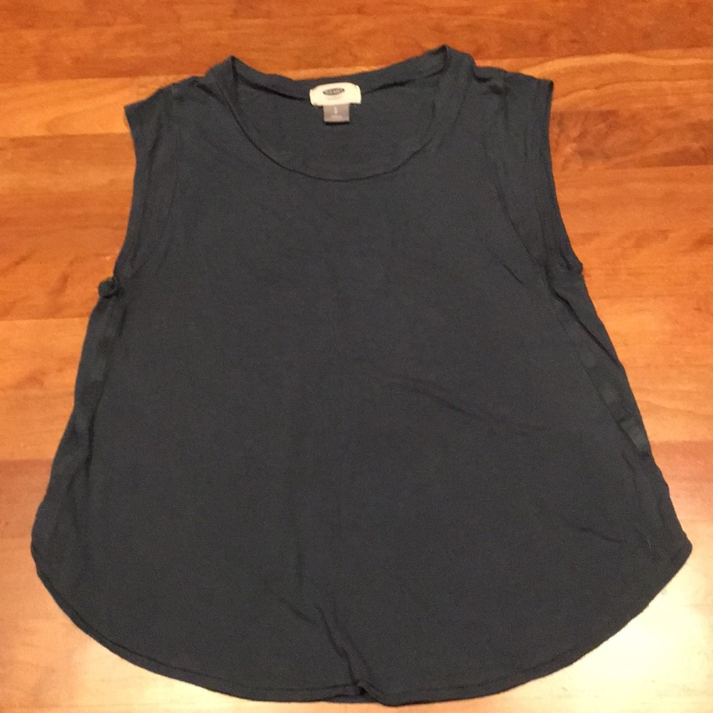 Dark green, sleeveless shirt.